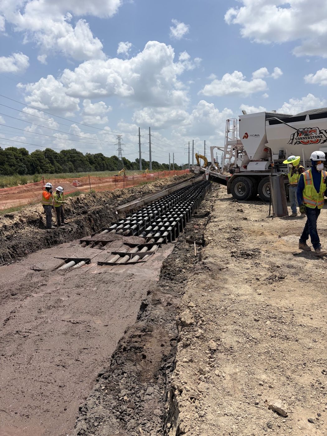 Cornerstone mixer pouring over a multi-conduit duct bank